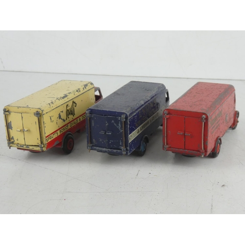 512 - Three vintage Dinky Toys 'Guy' lorries - Spratts, Lyons Swiss Rolls, and Sumberland.