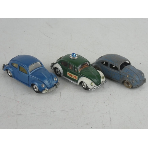 534 - A Corgi Toys Volkswagen 1200 saloon car, a Dinky Toys Volkswagen and Volkswagen De Luxe cars.