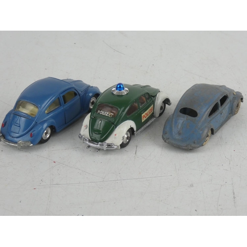 534 - A Corgi Toys Volkswagen 1200 saloon car, a Dinky Toys Volkswagen and Volkswagen De Luxe cars.