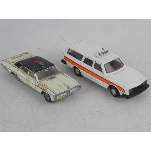 535 - A Dinky Toys Pontiac Parisenne police car and a Dinky Toys Volvo 265 Estate car.