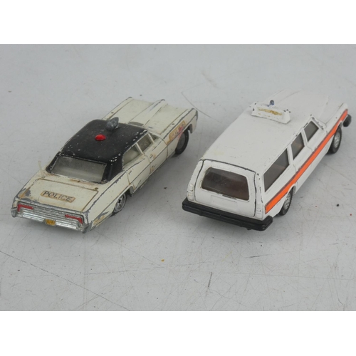 535 - A Dinky Toys Pontiac Parisenne police car and a Dinky Toys Volvo 265 Estate car.