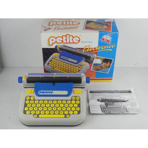 19 - A vintage boxed Petite child's typewriter.