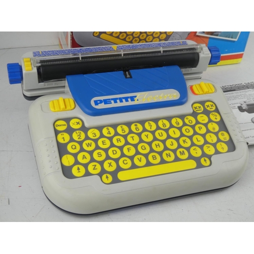 19 - A vintage boxed Petite child's typewriter.