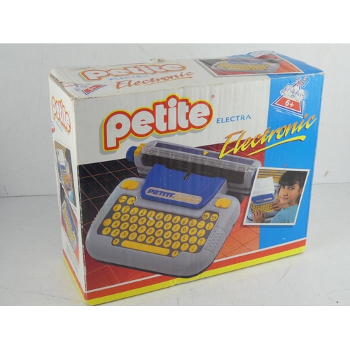 19 - A vintage boxed Petite child's typewriter.