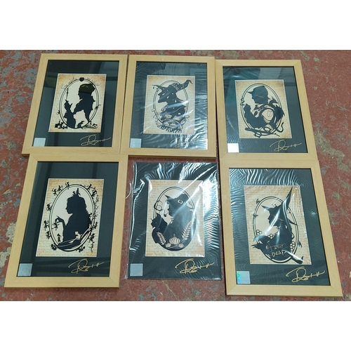 17 - A set of 6 Terry Pratchett prints, signed in pen by the Artist.