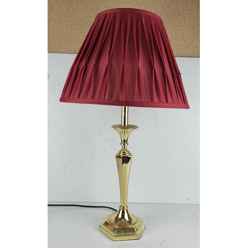 23 - A large decorative brass table lamp with shade.