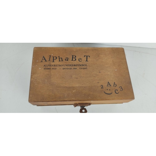 25 - A vintage alphabet stamp kit.