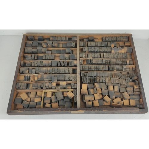 40 - A vintage printers typeset tray with collection of wood block letters.