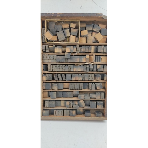 40 - A vintage printers typeset tray with collection of wood block letters.