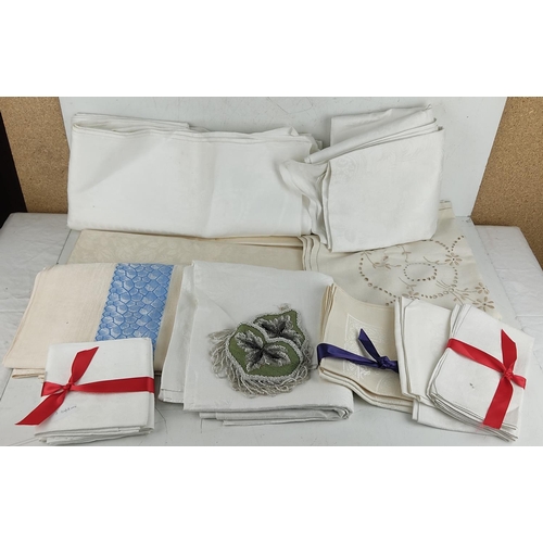 43 - 6 large damask linen table cloths and other linen napkins including a Victorian Beaded pocket.