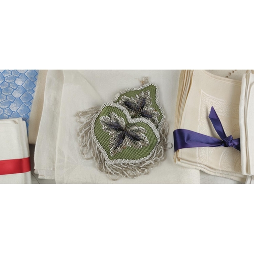 43 - 6 large damask linen table cloths and other linen napkins including a Victorian Beaded pocket.