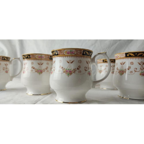 68 - 14 Queen's fine bone china mugs.