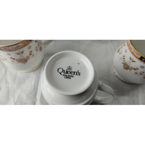 68 - 14 Queen's fine bone china mugs.