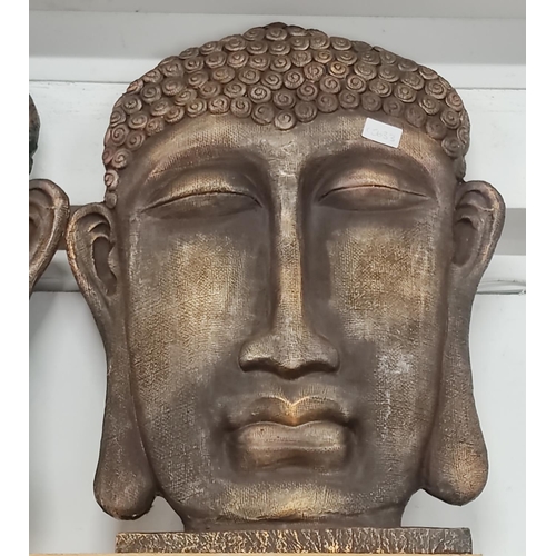 76 - A  pair of large Buddha head. 57x44cm.