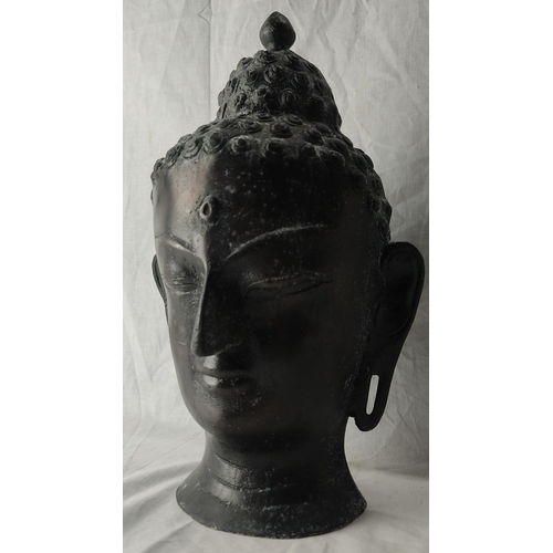 77 - A stunning metal Buddha head. 37cm tall