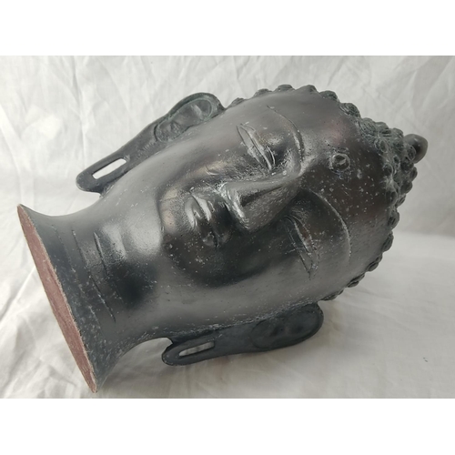 77 - A stunning metal Buddha head. 37cm tall