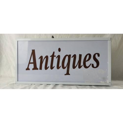 87 - An illuminated 'Antiques' sign.