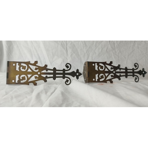 88 - A pair of large ornate hinges.