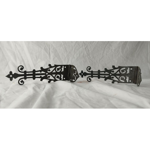 88 - A pair of large ornate hinges.