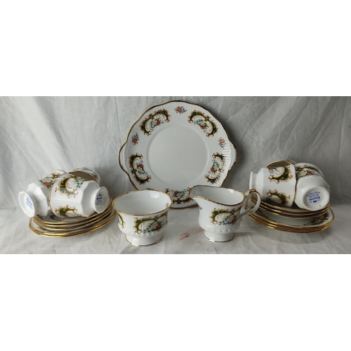 90 - A Queen's fine bone china tea set including cake plate, milk jug and sugar bowl.