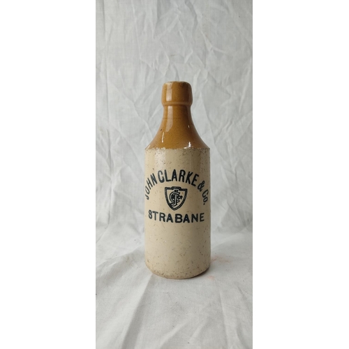 91 - An antique stoneware beer bottle 'John Clarke & Co, Strabane'.