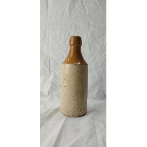 91 - An antique stoneware beer bottle 'John Clarke & Co, Strabane'.