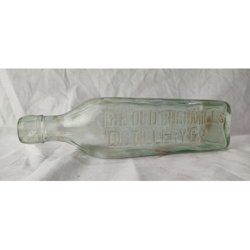 92 - An antique Old Bushmills Distillery Co whisky bottle.