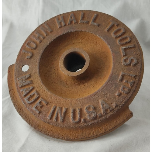 94 - An antique cast iron cover 'John Hall Tools Ltd, made in USA'.