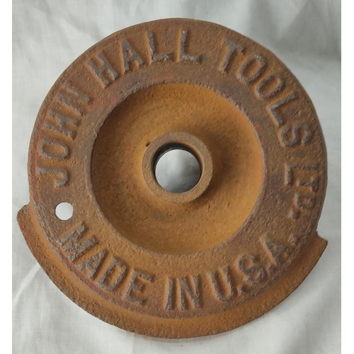 94 - An antique cast iron cover 'John Hall Tools Ltd, made in USA'.