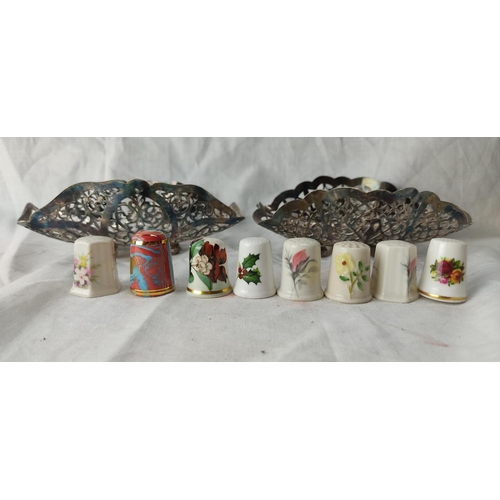 95 - A pair of vintage pierced silver plated dishes and a collection of ceramic thimbles to include Belle... 