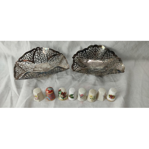 95 - A pair of vintage pierced silver plated dishes and a collection of ceramic thimbles to include Belle... 