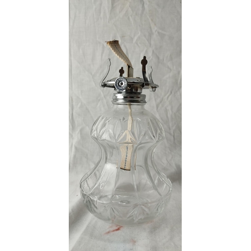 97 - A vintage clear glass oil lamp.