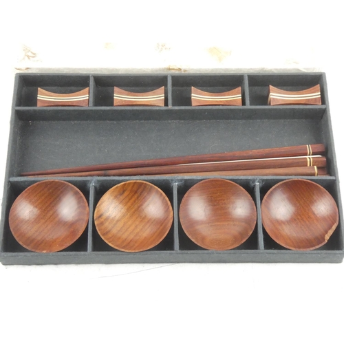 102 - A boxed set of wooden dipping bowls and chopstick set.