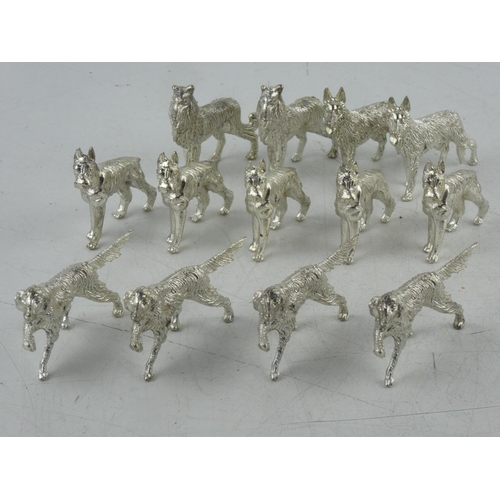 103 - A collection of metal dog figures.