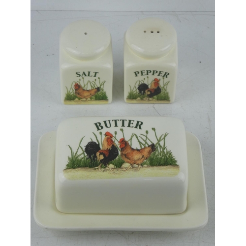 106 - A country style butter dish and salt and pepper set.