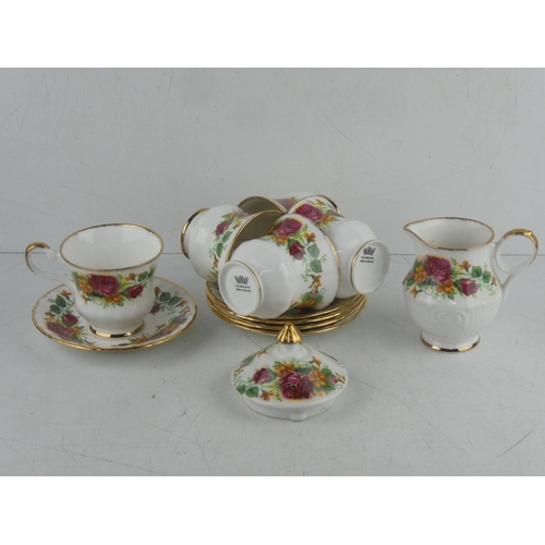 110 - A part fine bone china tea set in the style of Old Country Rose pattern.