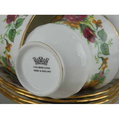 110 - A part fine bone china tea set in the style of Old Country Rose pattern.