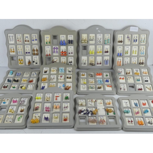 183 - A lot of new shop stock earrings on display cards.