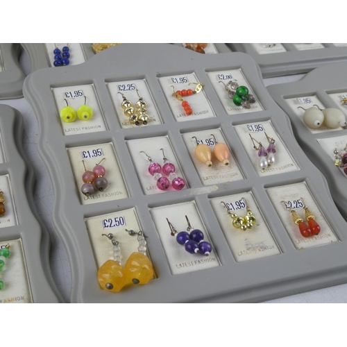 183 - A lot of new shop stock earrings on display cards.
