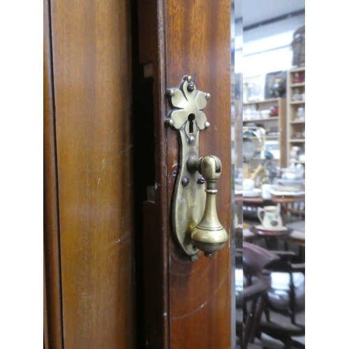 188 - A stunning antique mahogany wardrobe with carved panels and mirror.