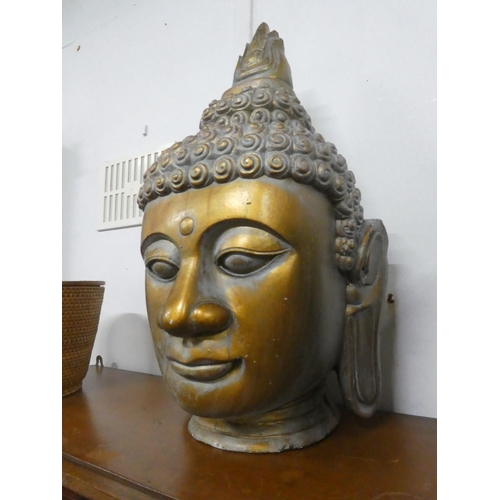 218 - A large ceramic Buddha head, measuring 25.5inches.