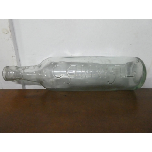226 - An antique Camwal glass bottle.