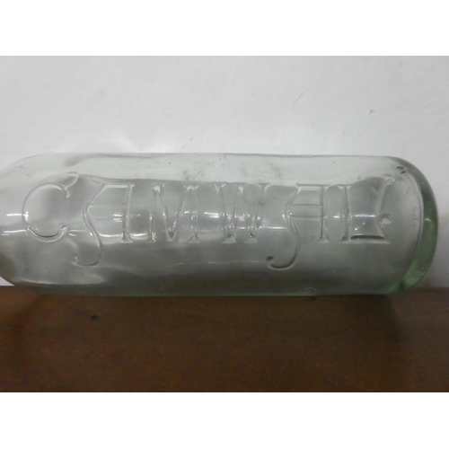 226 - An antique Camwal glass bottle.