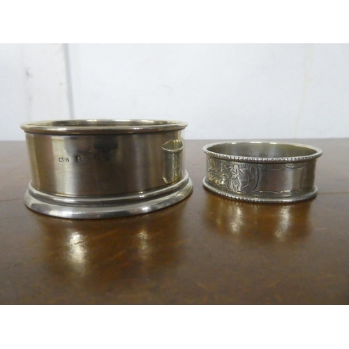 227 - An antique sterling silver napkin ring & base.