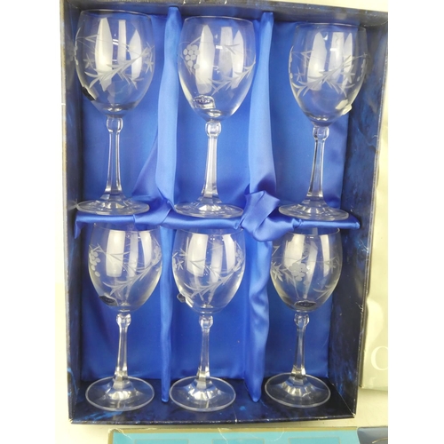 463 - A boxed set of six Irish Duiske crystal wine glasses and two other boxed sets of glasses.