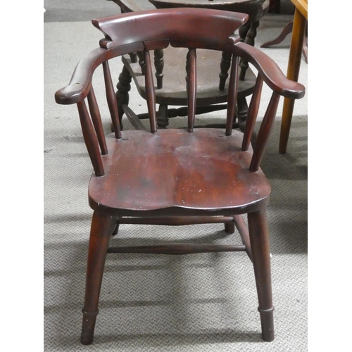 468 - An antique bow back smokers chair..