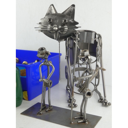 480 - A novelty wine bottle holder in the style of a cat, a metal golfer ornament made from nuts and bolts... 