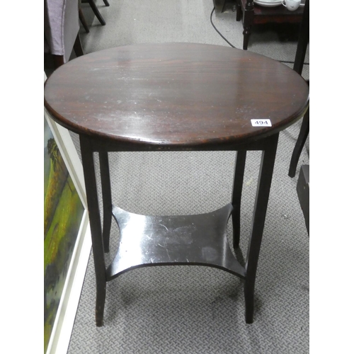 494 - An oval topped lamp table with undershelf.