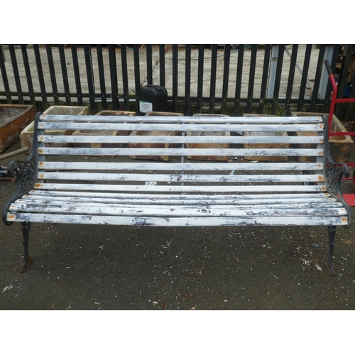 509 - A summer seat/ bench with decorative cast iron ends.