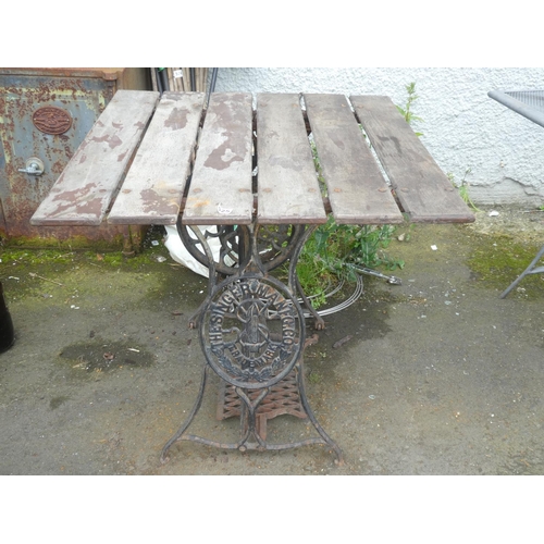 525 - An antique Singer Sewing machine base converted to a table.